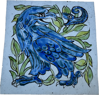 Partially painted on glass - replica of a de Morgan tile of an eagle and a snake