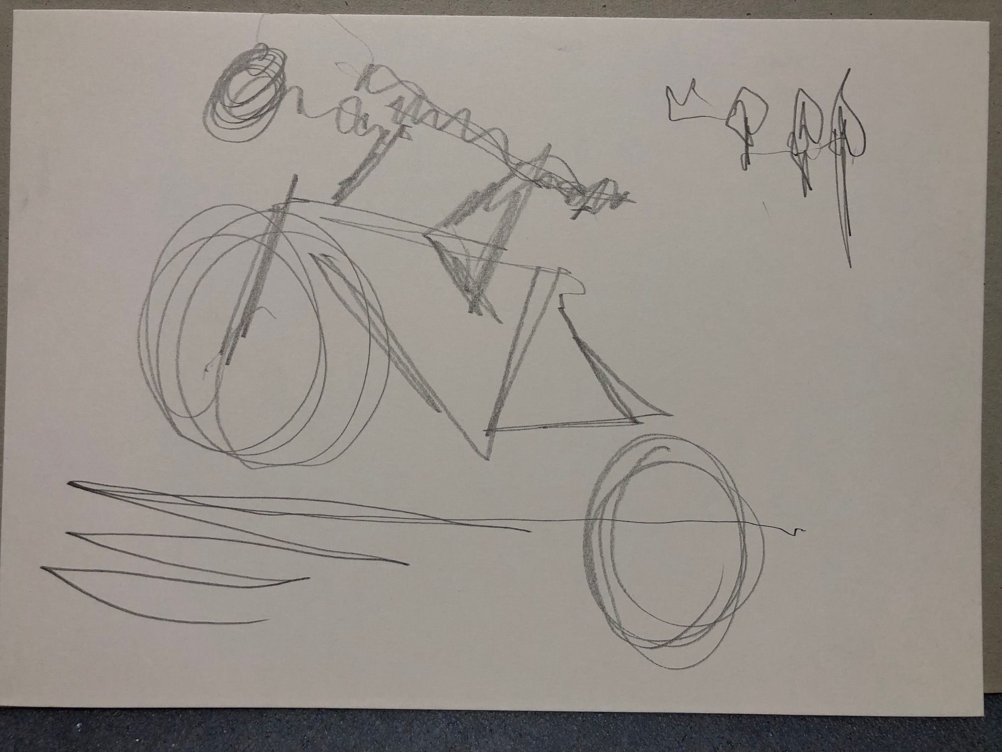 Graphite on cartridge paper. A cyclist riding up hill  - drawn with my eyes closed so the drawing is disjointed and apparently, the back wheel has dropped off!