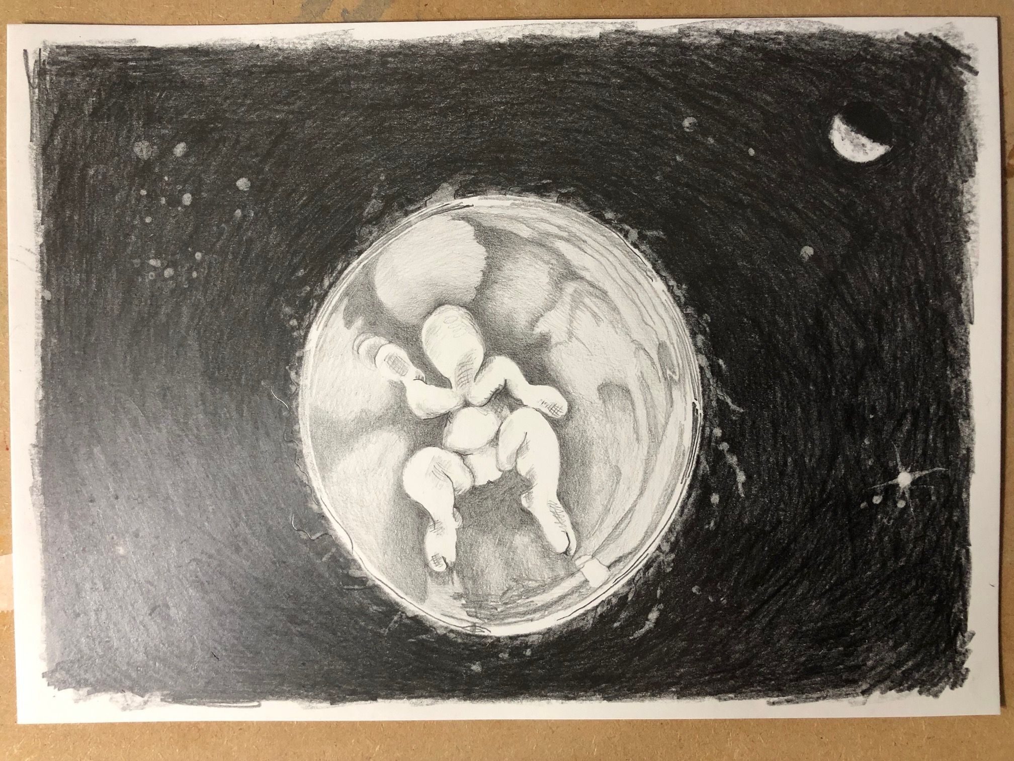 An imaginary creature is rotating through space in a clear bauble. Stars and a moon can be seen. A graphite drawing on cartridge paper.