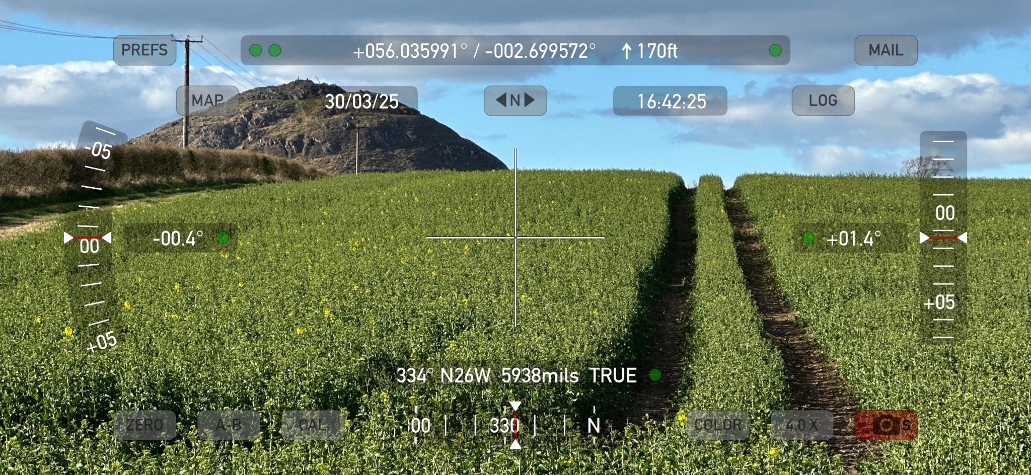 Screenshot of theodolite software readout superimposed on a landscape