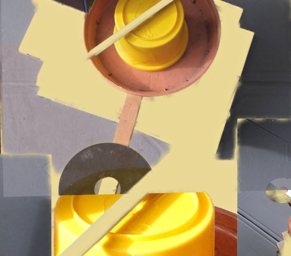 Objects were stacked taking turns and photographed then manipulated and passed between us and further worked, the outcome being a jumble of shapes that were primarily yellow and black.