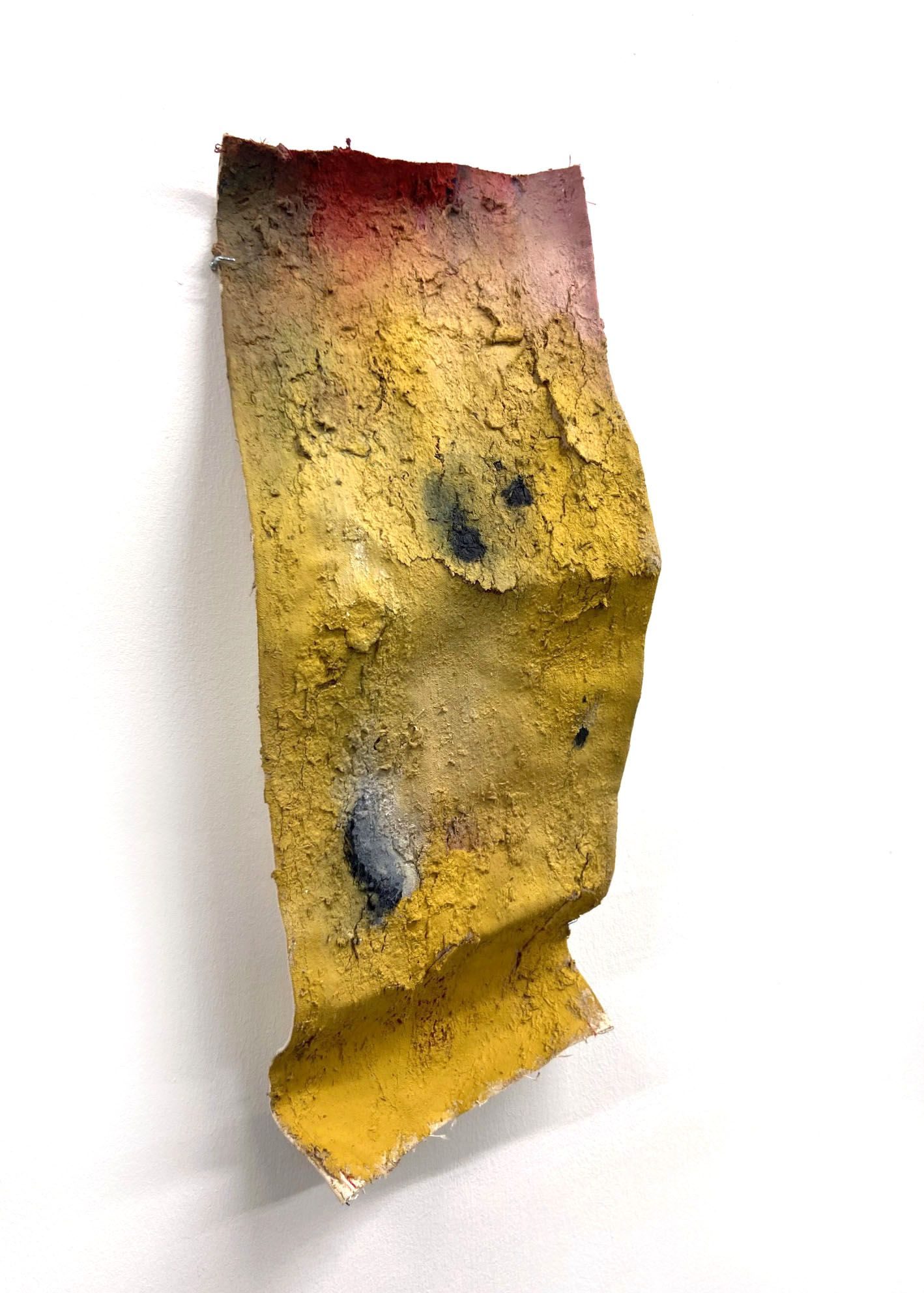 cracked and peeling ink-making waste, clay and natural pigment (yellow ochre, red madder and oak gall ink) on repurposed canvas formed with wire