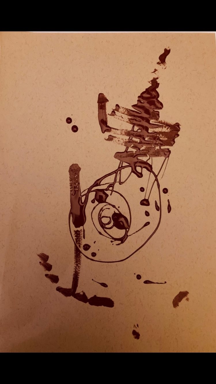 Old dusky rose nail polish swirled and patterned on brown paper