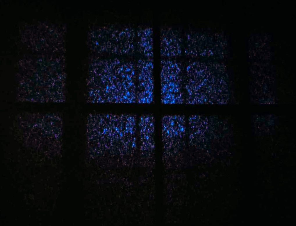 A photo of a blackout blind over a window, with some light coming through