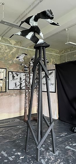 The forms made in the air by birds landing on a derrick, made as a solid form sitting on a derrick