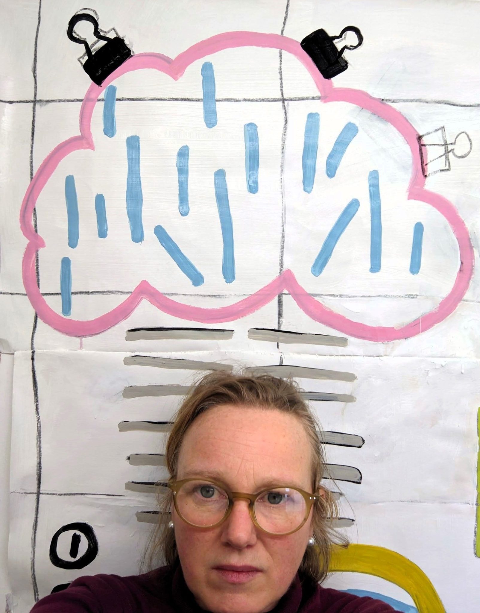 me, under a paper painting of a cloud.