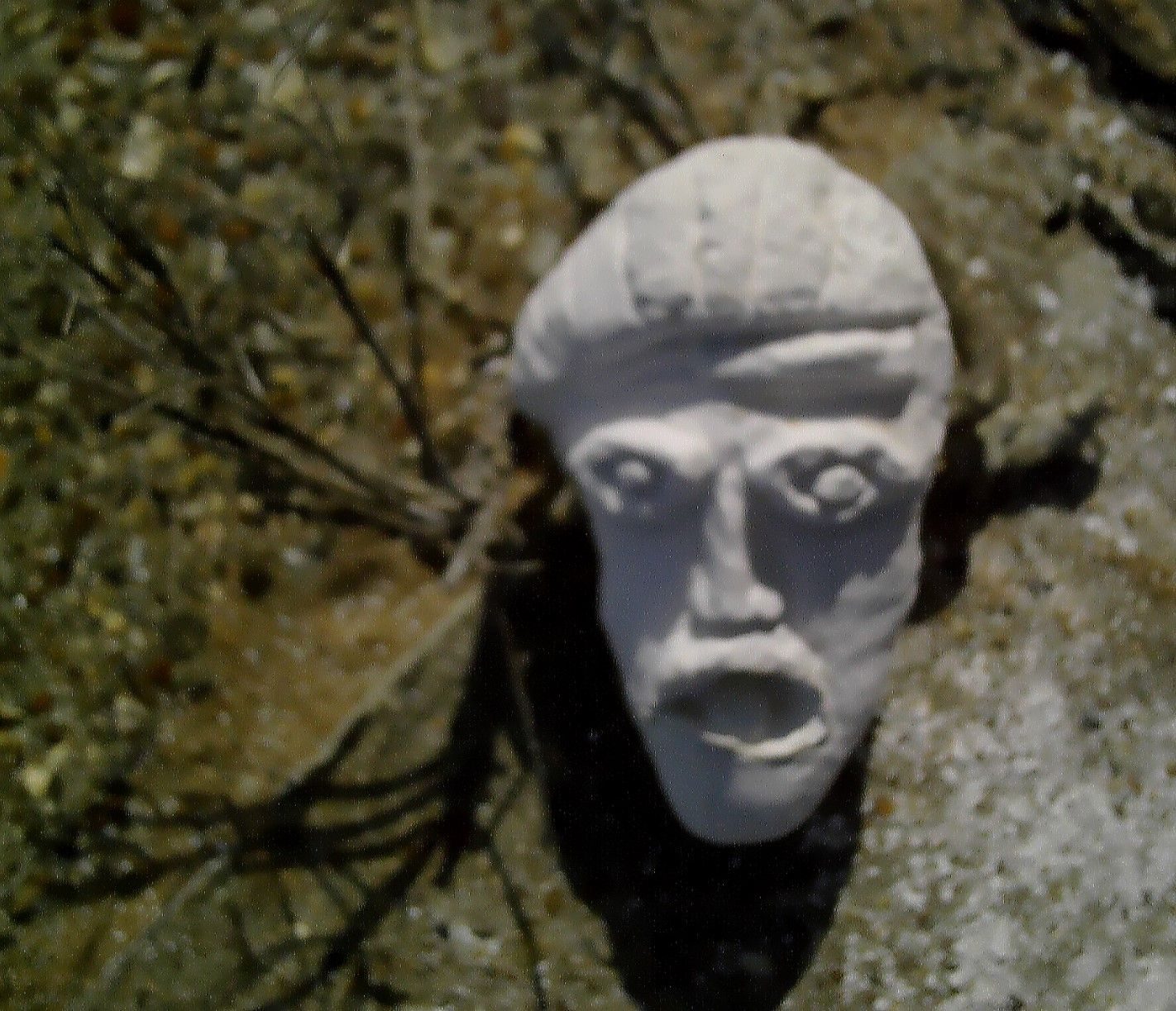 sculpted head at  the seaside