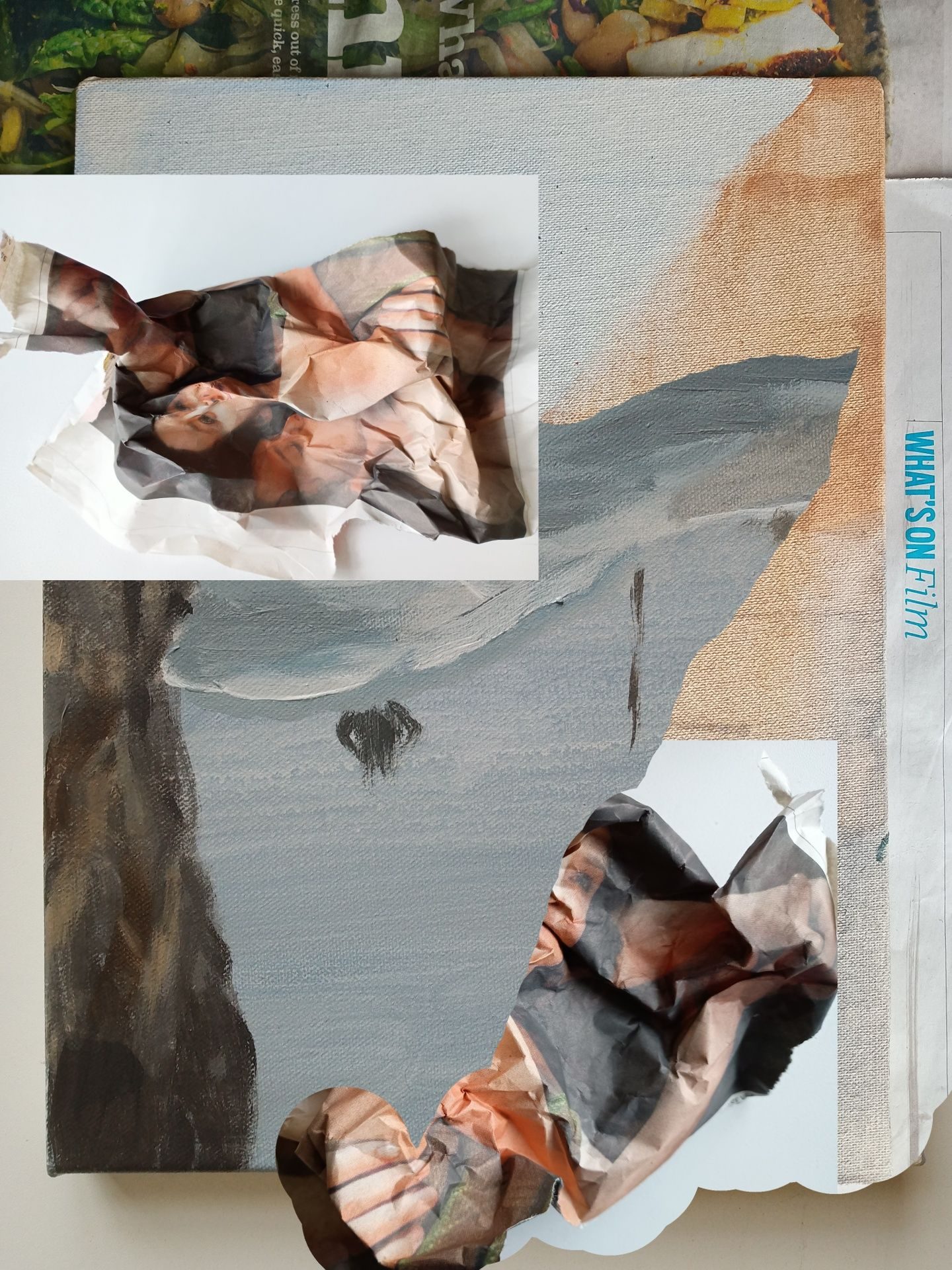 Photomontage of several abstract paintings and screwed up pieces of newspaper