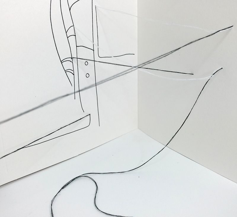 abstract drawing with black and white thread and black pen, the threads stretching in space, one strand of black thread curled on the floor