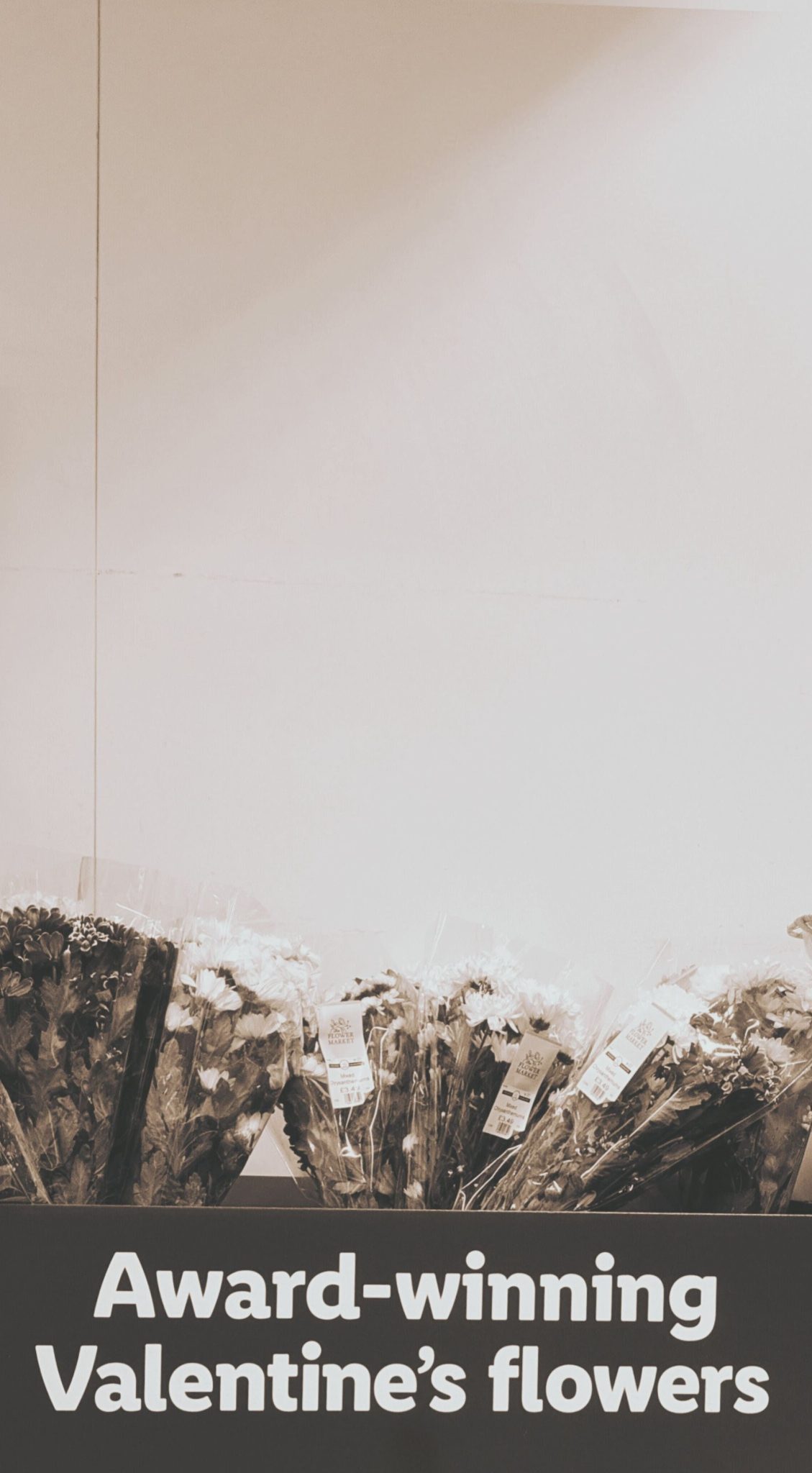 a picture of a box with flowers that says 