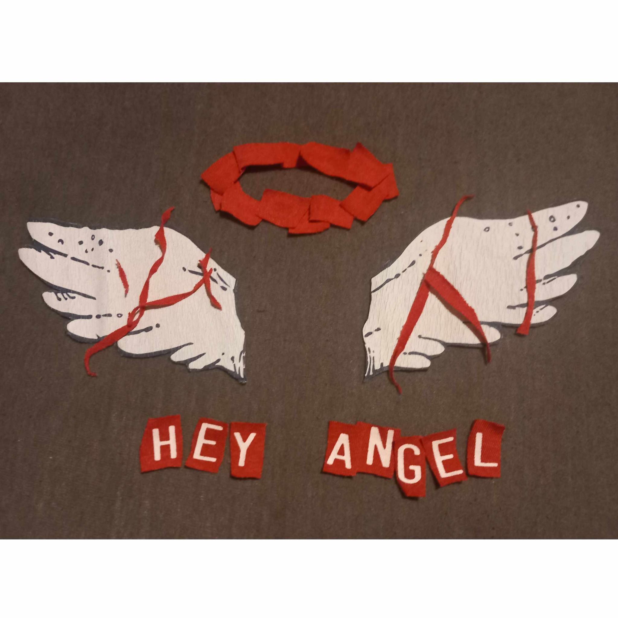 fabric collage of letters and graphic elements cut out of old tshirts