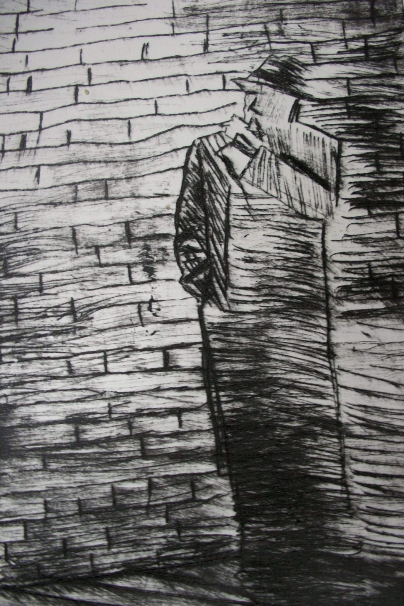 Black and white sketch of man by a brick wall , he has a long overcoat on aa tribey hat like a 1920s ganster