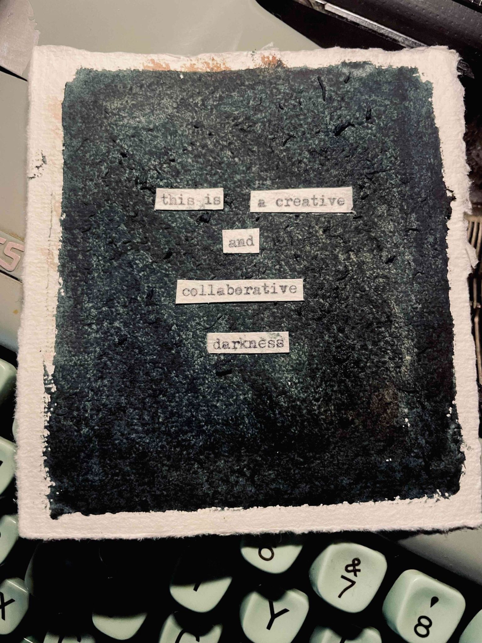 a painted dark square with some writing over the top