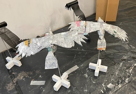 Two crows made from newspaper
