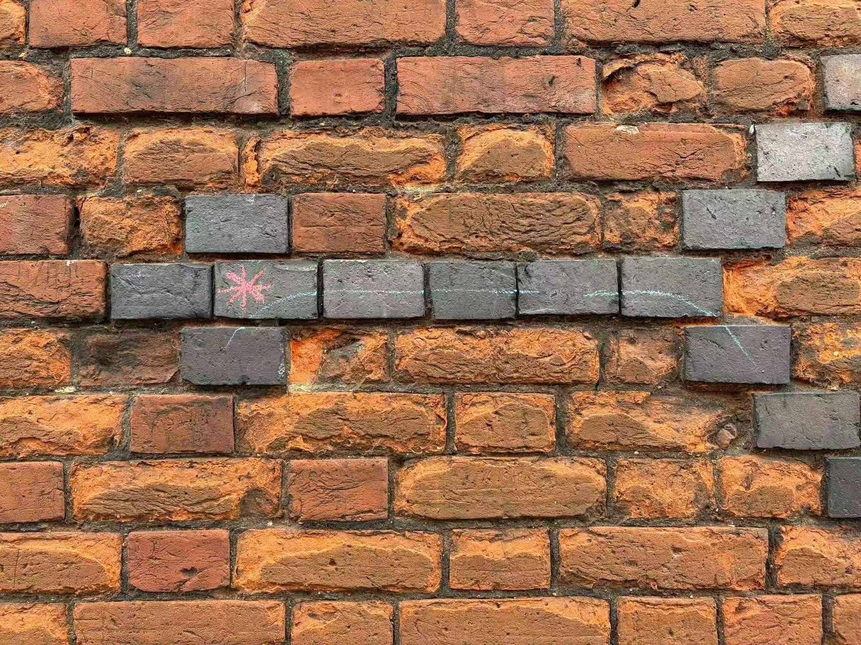 This is what I found along the way—bricks forming arrows with meteors bearing them—and it struck me as quite poetic.