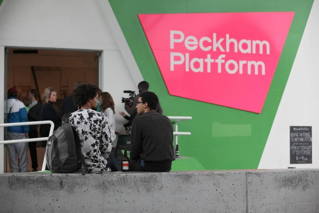 A crowd gather outside Peckham Platform